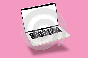 Laptop computer mock up with empty blank white screen isolated on pink background. float or levitate laptop notebook with shadow.