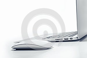 Laptop computer with mouse.