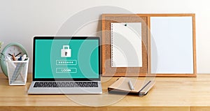 Laptop computer with password login on screen, cyber security concept