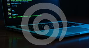 Laptop Computer Screen Showing Green Coding in Dark Environment