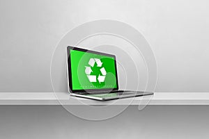 Laptop computer on a shelf with a recycling symbol on screen. environmental conservation concept