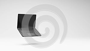 Laptop Computer Spinning on Studio Light Gray Background