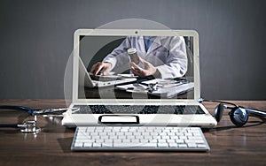 Laptop computer, stethoscope, headset. Online doctor. Telemedicine concept