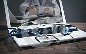 Laptop computer, stethoscope, headset. Online doctor. Telemedicine concept