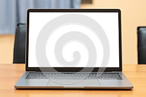 Laptop computer with white blank screen on wood desk. Workspace, workplace, desktop office concept