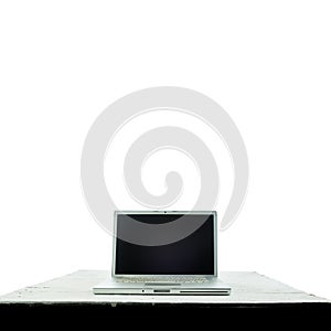 Laptop computer on white wooden texture background. Work from home concept