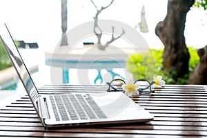 Laptop computer on the wood table