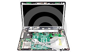 Laptop disassembled with two wrenches on it
