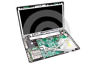 Laptop disassembled with wrench on it