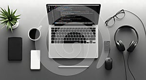 Minimalist flat lay of a coder's essential workspace with a laptop and coding interface