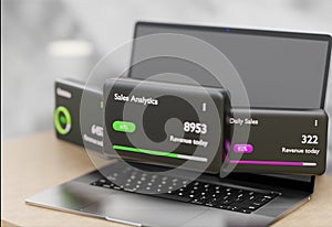 Sales analytics dashboard on laptop screens.