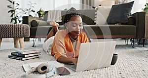 Laptop, education and a student black woman on the floor of a living room to study for a test or exam. Computer, smile