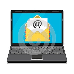 Laptop with envelope and open email on screen.