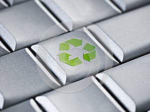 Recycle logo on a computer keyboard