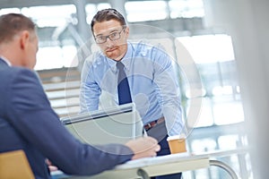 Laptop, finance team and portrait of businessman review financial portfolio, stock market database or investment