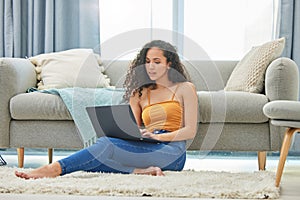 Laptop, floor and woman in home online for remote work, online shopping and browse internet. Weekend, apartment and