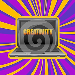 Laptop in front view with word creativity