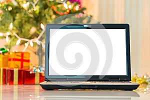 Laptop with gift box and christmas lights