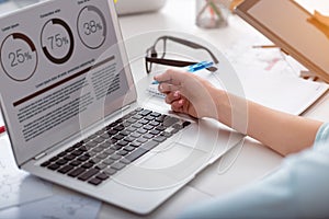 Laptop with graphics on a table