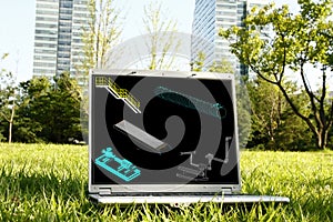 Laptop on Grass with 3D Model