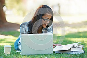 Laptop, grass or happy woman in park with books for learning knowledge, information or education. Smile, textbooks or