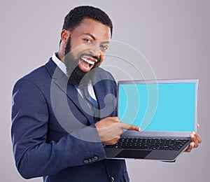 Laptop, green screen and black man isolated on gray background portrait for business software mockup or product