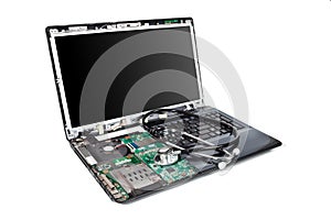 Laptop half disassembled with stethoscope on it