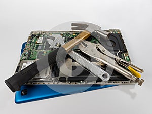 Laptop with hammer, spanners and locking pliers