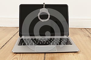 Laptop and handcuff