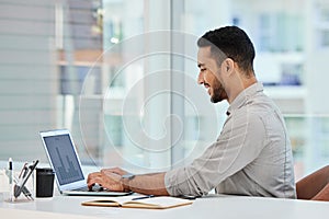 Laptop, happy and business man typing for research, analytics and reading data in office. Computer, graphs and smile of