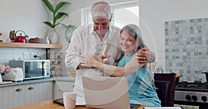 Laptop, happy and couple hugging in kitchen networking on social media, website or the internet. Smile, technology and