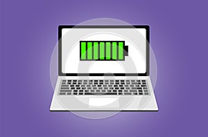 The laptop with an icon of the charged battery on the screen on a violet background