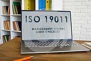 Laptop with info about ISO 19011 Management Systems audit checklist.