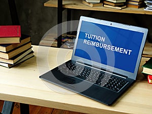 Laptop with information about Tuition Reimbursement.