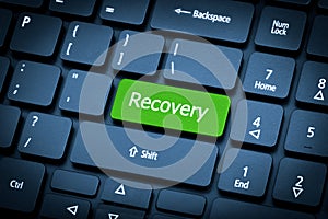Laptop keyboard. The focus on the Recovery key. photo