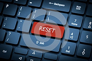 Laptop keyboard. The focus on the Reset key.