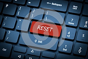 Laptop keyboard. The focus on the Reset key. photo