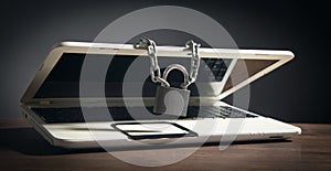 Laptop locked with chains and padlock