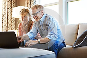 Laptop, mature or happy couple in home typing for savings, property investment or online shopping together. Ecommerce