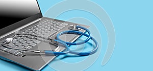 Laptop With Medical Diagnostic Software And Stethoscope. Stethoscope And Laptop isolated on blue background. Telehealth concept.