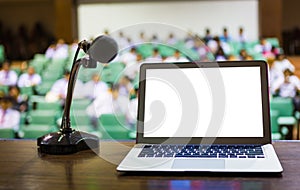 Laptop and microphone on the rostrum