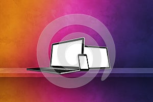 Laptop, mobile phone and digital tablet pc on rainbow wall shelf. Horizontal background