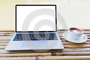 Laptop mockup and hot espresso in a white coffee mug