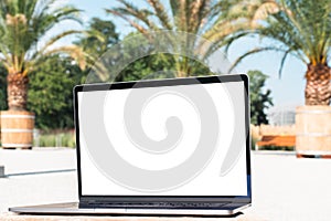 laptop mockup. Notebook with white screen with palm tree leafs on background. Vacation, traveling and remote work and