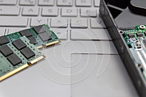 Laptop and notebook data storage components like hdd, hard disk drive, ram memory show data backup, data security and technical