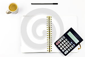 Laptop, Notebook and Office Supply Items on white Work Desk with coffee