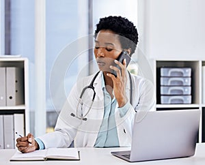 Laptop, notebook and phone call with doctor black woman in hospital office for appointment. Computer, schedule and