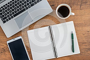 Laptop, notebook, Tablet and coffee on work desk