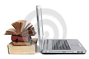 Laptop and old books