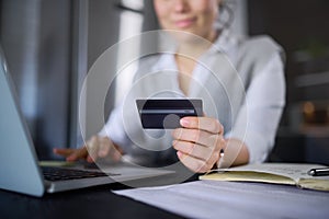 Laptop, online shopping and hands of woman with credit card for digital banking or payment. Ecommerce, fintech and